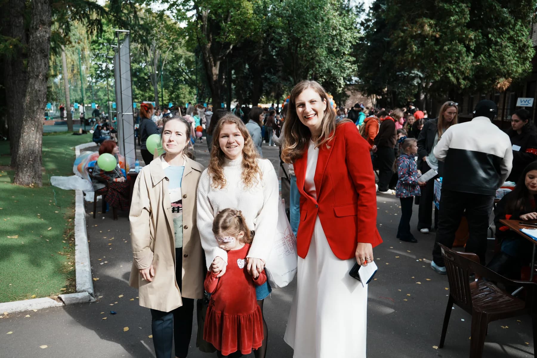 Families smiling together during ANGLO fest